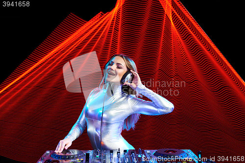 Image of DJ girl on decks at the party