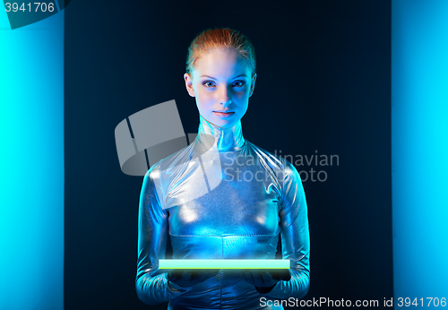 Image of Futuristic young woman in silver clothing