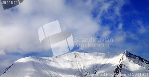 Image of Panoramic view on off-piste snowy slope in wind day