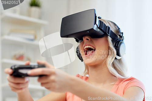 Image of woman in virtual reality headset with controller