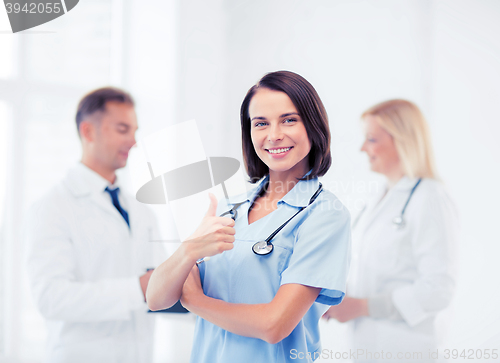 Image of team of doctors showing thumbs up