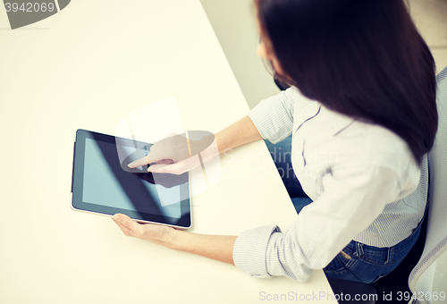 Image of close up of woman hands with tablet pc at office
