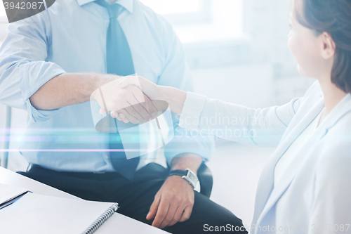 Image of business people shaking hands in office