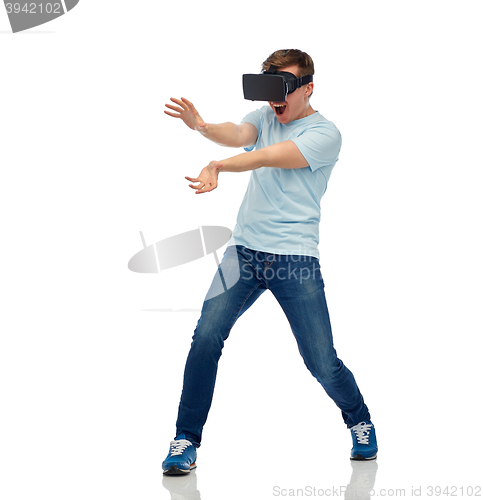 Image of happy man in virtual reality headset or 3d glasses