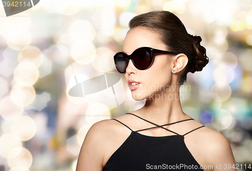 Image of beautiful young woman in elegant black sunglasses