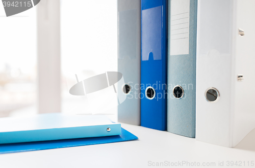 Image of close up of ring binders and files on office table