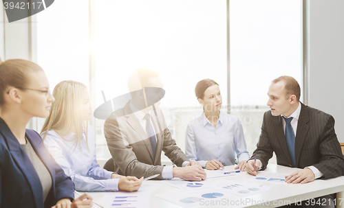 Image of smiling business team at meeting