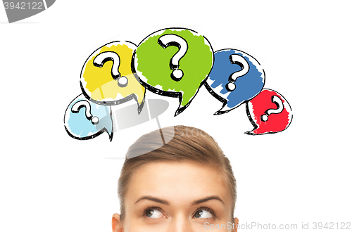 Image of happy young woman head with question marks