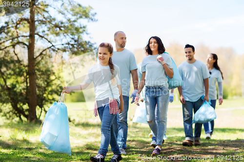 Image of group of volunteers with garbage bags in park