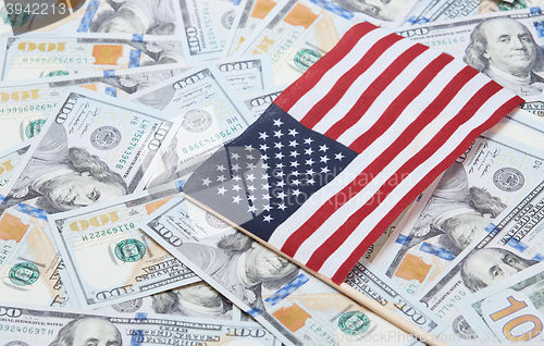 Image of US flag on one hundred dollars banknotes