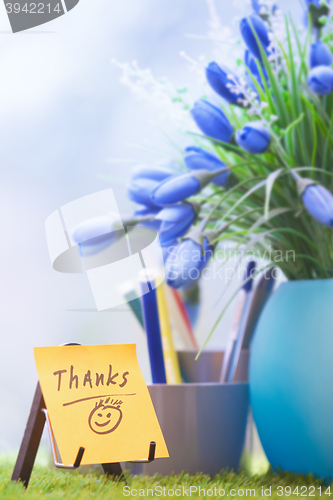 Image of Adhesive note with Thanks text at green office