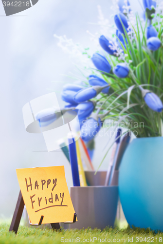 Image of Adhesive note with Happy Friday text  at green office