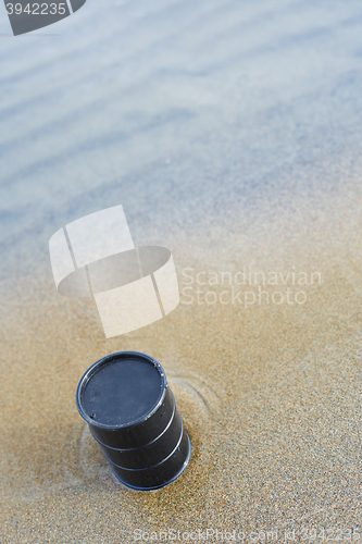 Image of Oil barrel abandoned at the sea coast