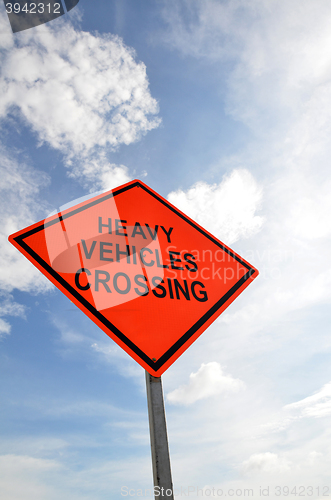 Image of Road sign with a Heavy Vehicles Crossing