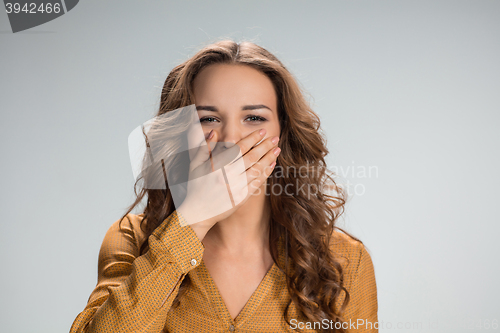 Image of The happy woman on gray background