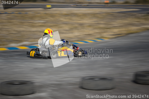 Image of Karting - driver in helmet on kart circuit