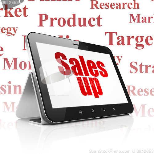 Image of Advertising concept: Tablet Computer with Sales Up on display