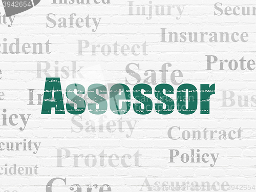 Image of Insurance concept: Assessor on wall background