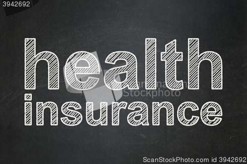 Image of Insurance concept: Health Insurance on chalkboard background