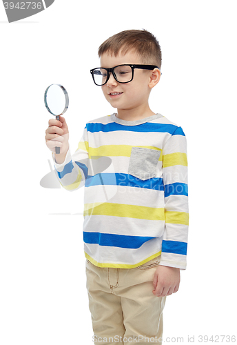 Image of little boy in eyeglasses with magnifying glass