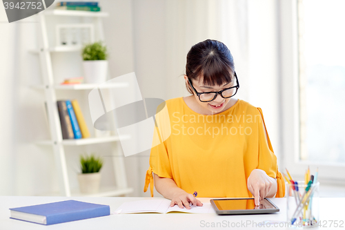 Image of asian woman student with tablet pc at home