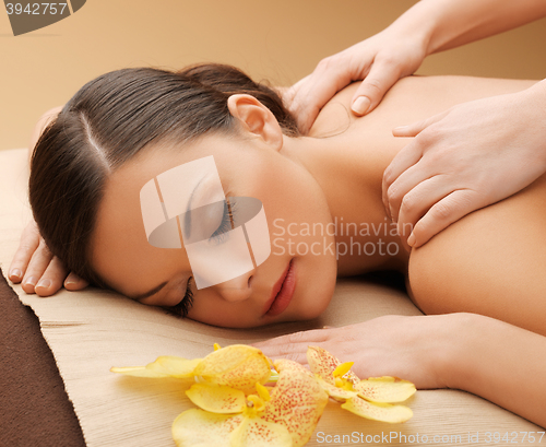 Image of beautiful woman in massage salon