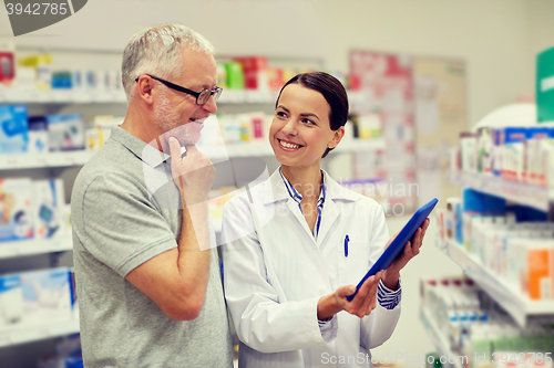 Image of pharmacist with tablet pc and senior man