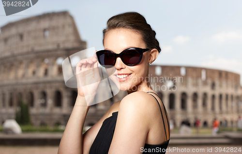 Image of beautiful young woman in elegant black sunglasses