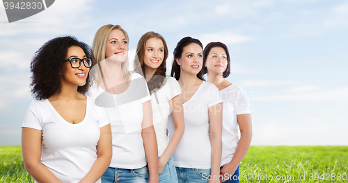 Image of group of happy different women in white t-shirts