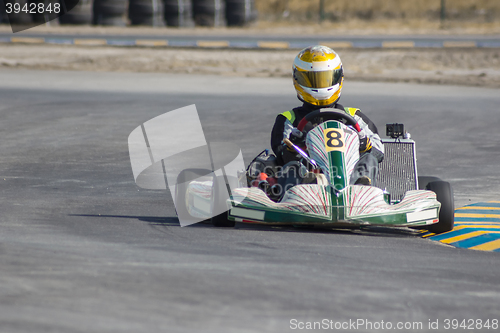 Image of Karting - driver in helmet on kart circuit