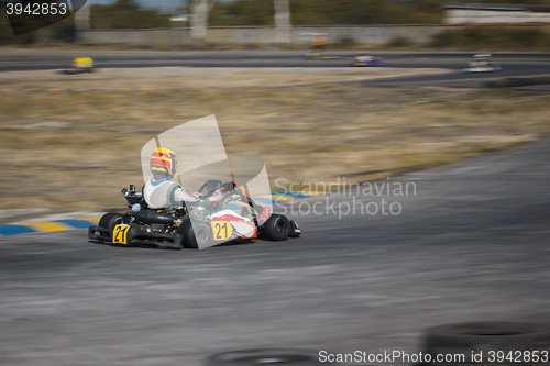 Image of Karting - driver in helmet on kart circuit