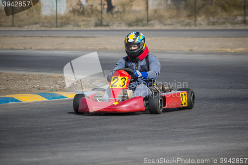 Image of Karting - driver in helmet on kart circuit