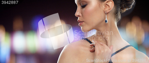 Image of close up of beautiful asian woman with earring