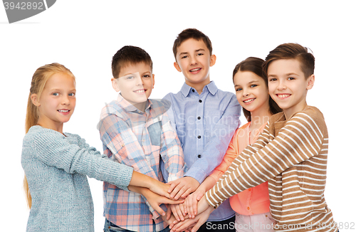 Image of happy children with hands on top