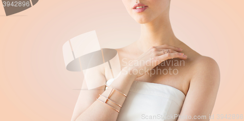 Image of close up of beautiful woman with ring and bracelet