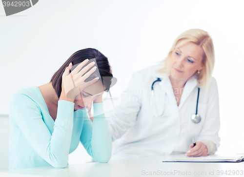 Image of doctor with patient in hospital