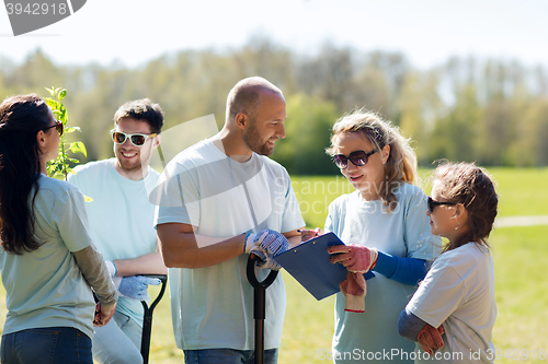 Image of group of volunteers planting trees in park