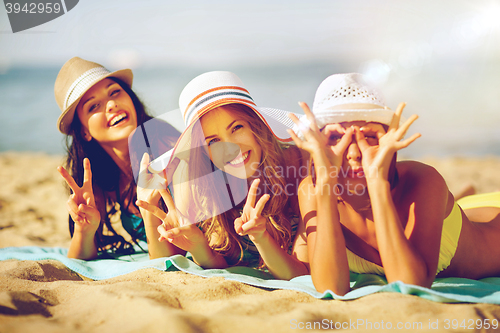 Image of girls sunbathing on the beach