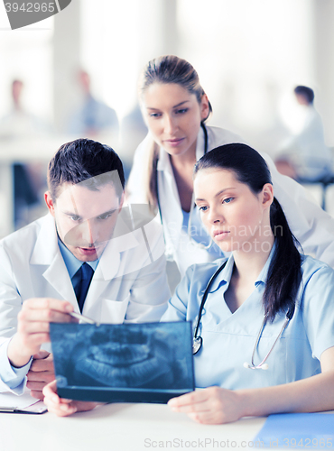 Image of group of doctors looking at x-ray