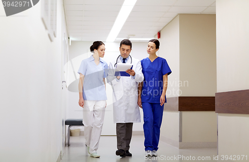 Image of group of medics at hospital with clipboard