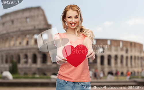 Image of happy woman or teen girl with red heart shape