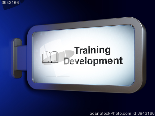 Image of Education concept: Training Development and Book on billboard background