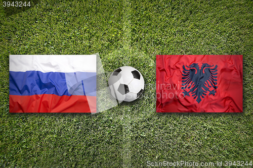 Image of Russia vs. Albania flags on soccer field