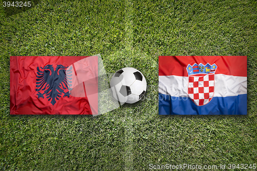 Image of Albania vs. Croatia flags on soccer field