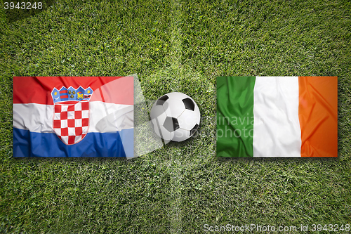 Image of Croatia vs. Ireland flags on soccer field