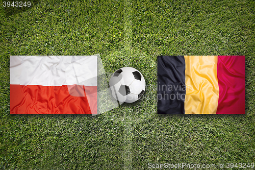 Image of Poland vs. Belgium flags on soccer field