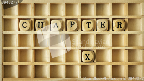 Image of wooden game with the word chapter ten