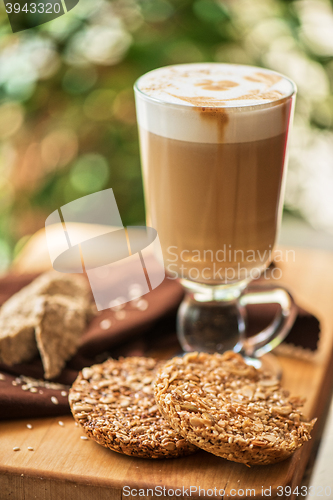 Image of coffee latte cup with cookies