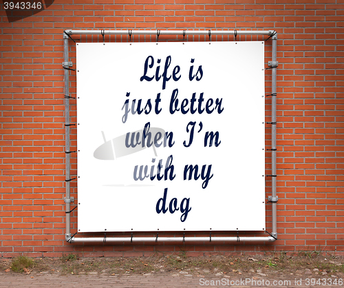 Image of Large banner with inspirational quote on a brick wall