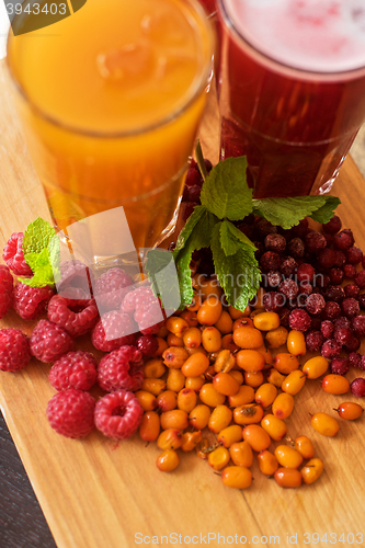 Image of fruit drink with cranberries raspberries and sea buckthorn